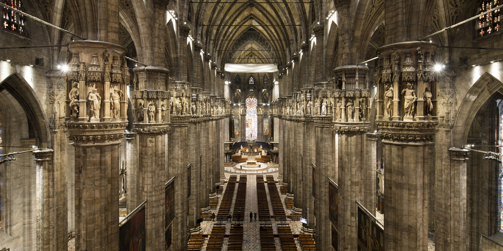 Interior of Milan Cathedral featuring ERCO LED lighting, highlighting the Gothic architecture.
