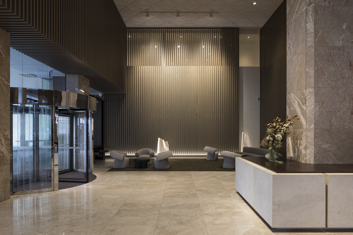 AON Lobby in Auckland featuring ERCO LED lighting for high walls and corridor wallwashing.