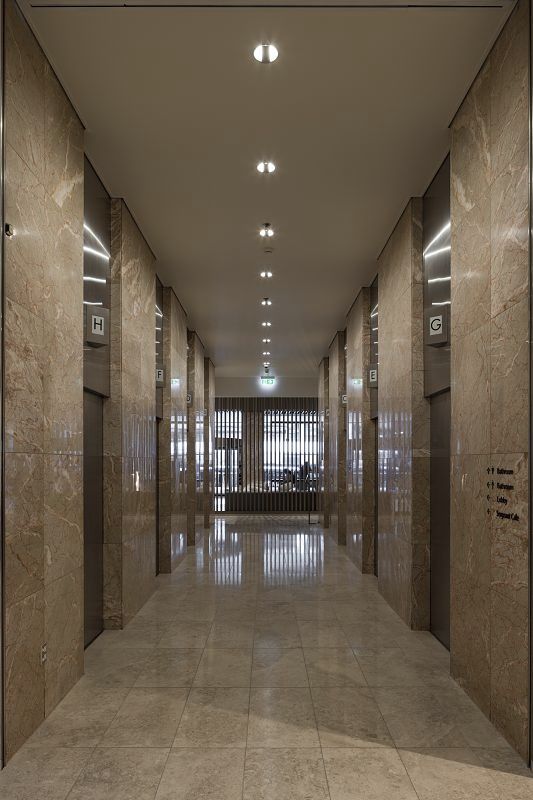 AON Lobby Auckland corridor featuring ERCO LED downlights for uniform lighting and orientation.