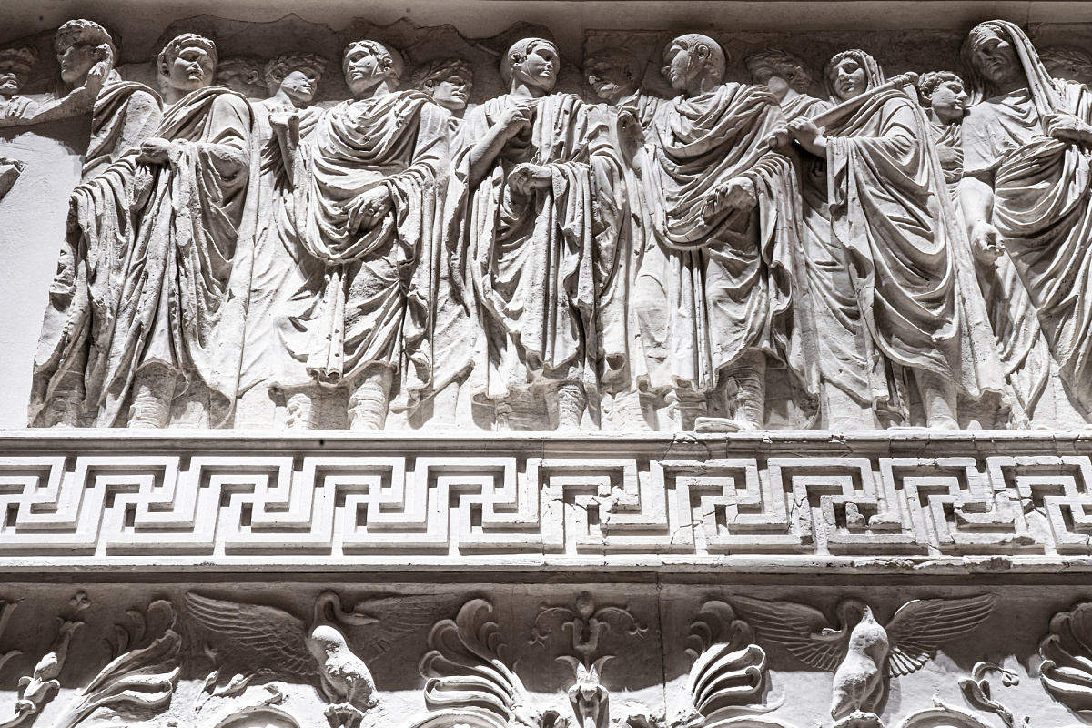 Detail of the Ara Pacis Museum in Rome, illuminated by ERCO LED spotlights highlighting marble reliefs.