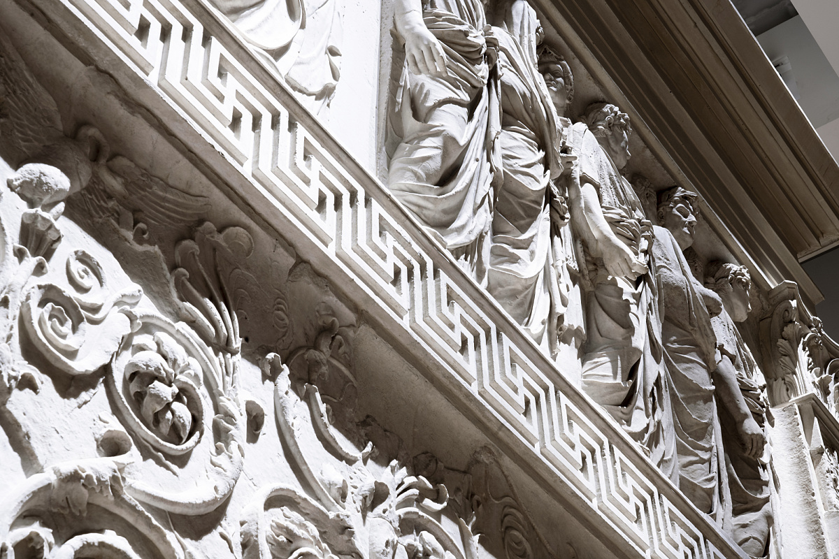 Detail of the Ara Pacis Museum in Rome, illuminated by ERCO LED spotlights highlighting the marble reliefs.