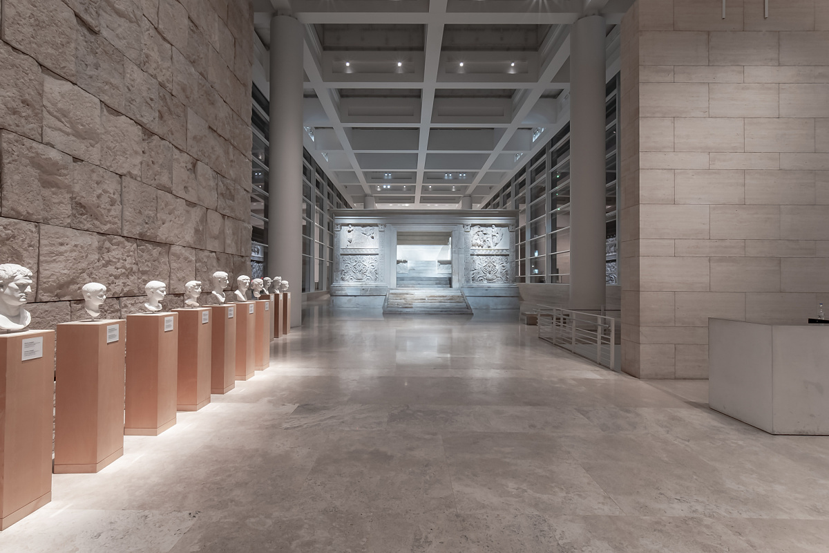 Interior of the Ara Pacis Museum in Rome, featuring ERCO LED lighting and ancient busts.