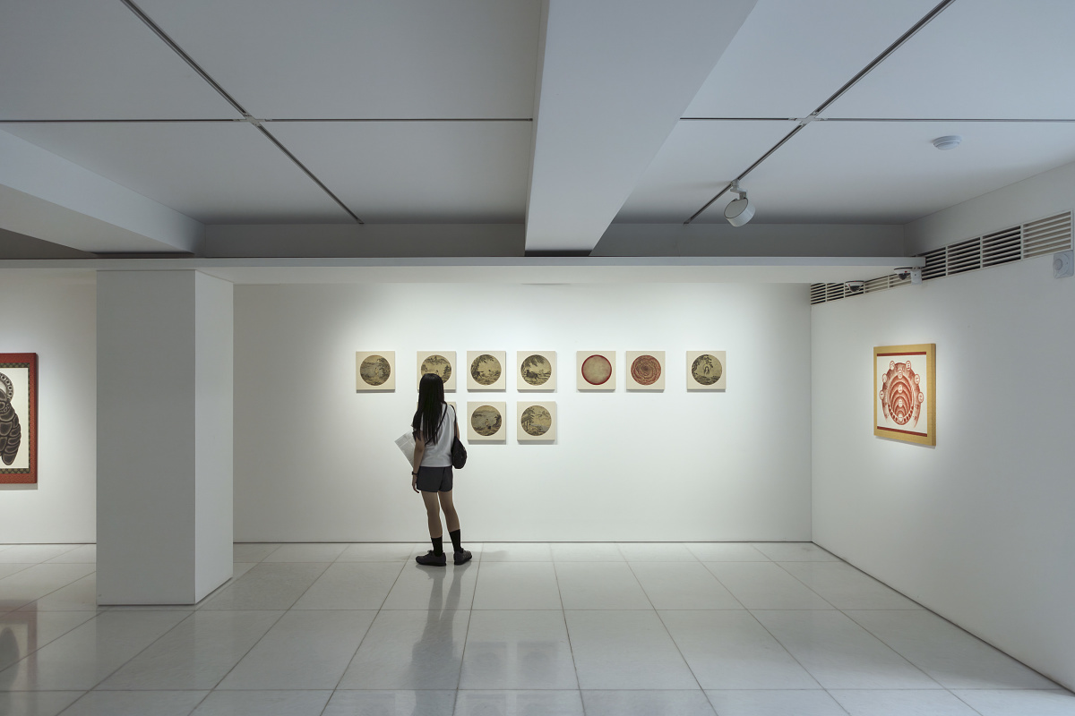 Visitor views art in Arario Gallery, Seoul, illuminated by ERCO spotlights.