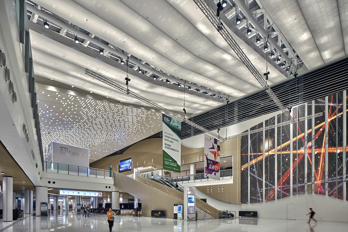 Asia World-Expo East Lobby illuminated by ERCO Kona floodlights, creating uniform light.