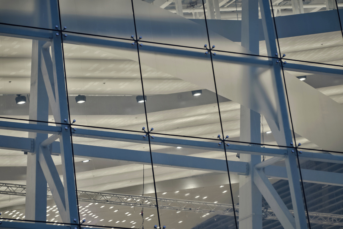 Asia World-Expos glass facade featuring interior ERCO lighting.