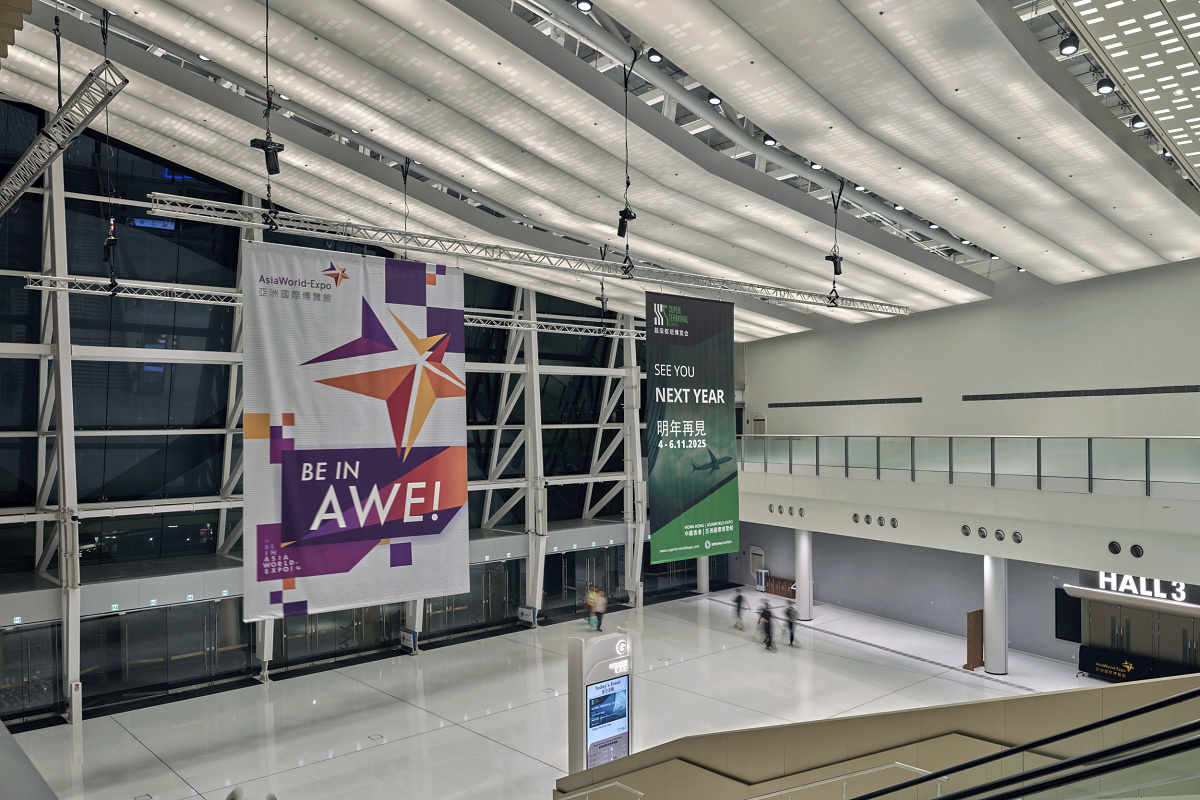 Asia World-Expo East Lobby illuminated by ERCO Kona floodlights, high ceiling lighting.