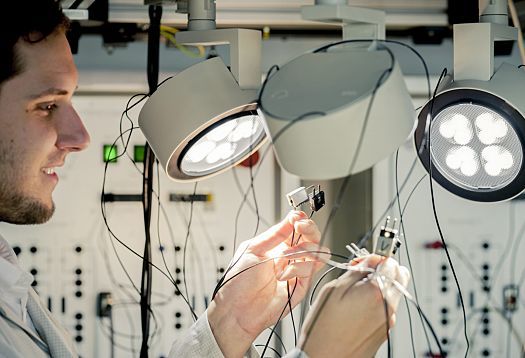 ERCO employee works on LED lighting in the lab, showcasing innovation and development.