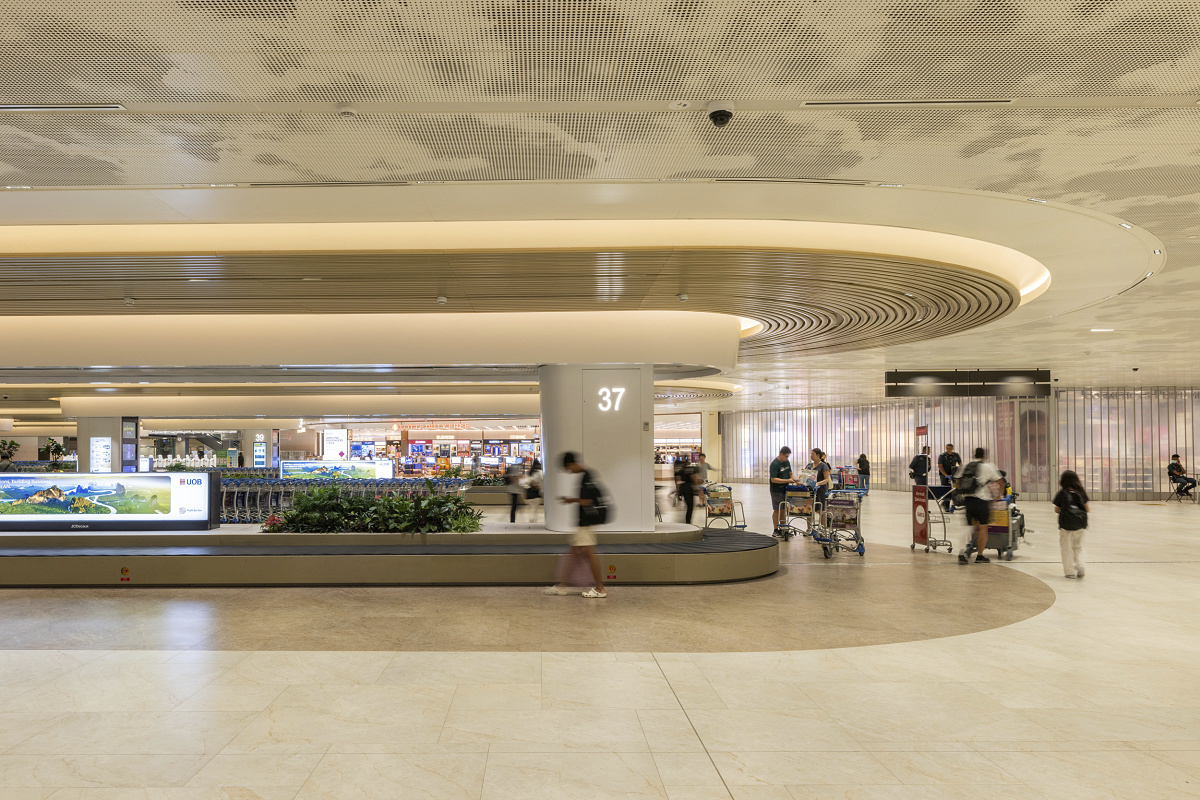 Changi Airport Terminal 2 featuring ERCO LED downlights for sustainable lighting in the expanded terminal.