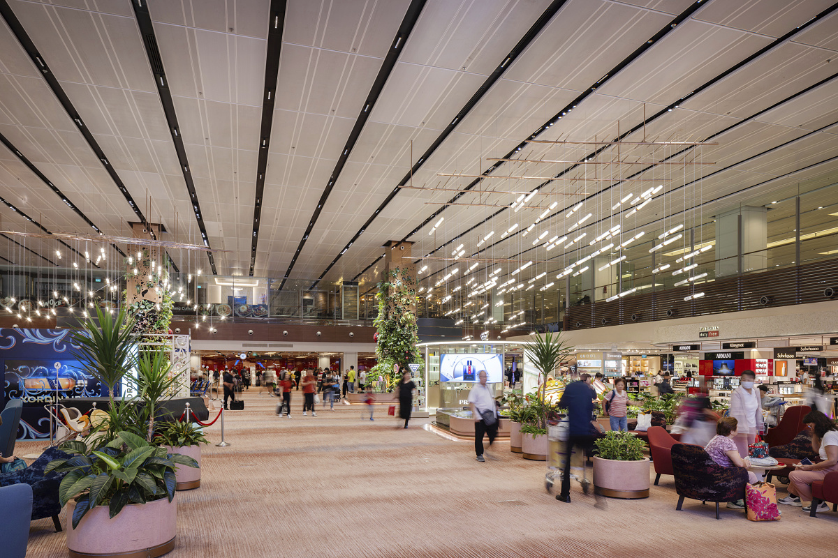 ERCO Compar LED downlights illuminate Singapore's Changi Airport Terminal 2, providing sustainable lighting.