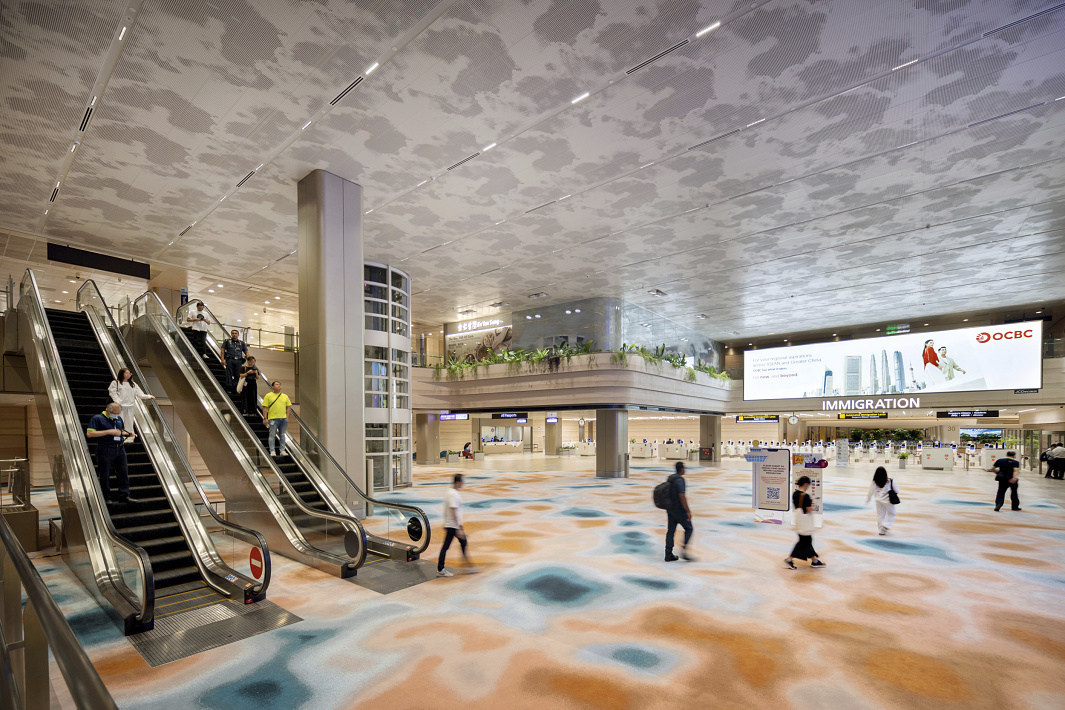Changi Airport Terminal 2 featuring ERCO downlights for sustainable lighting.