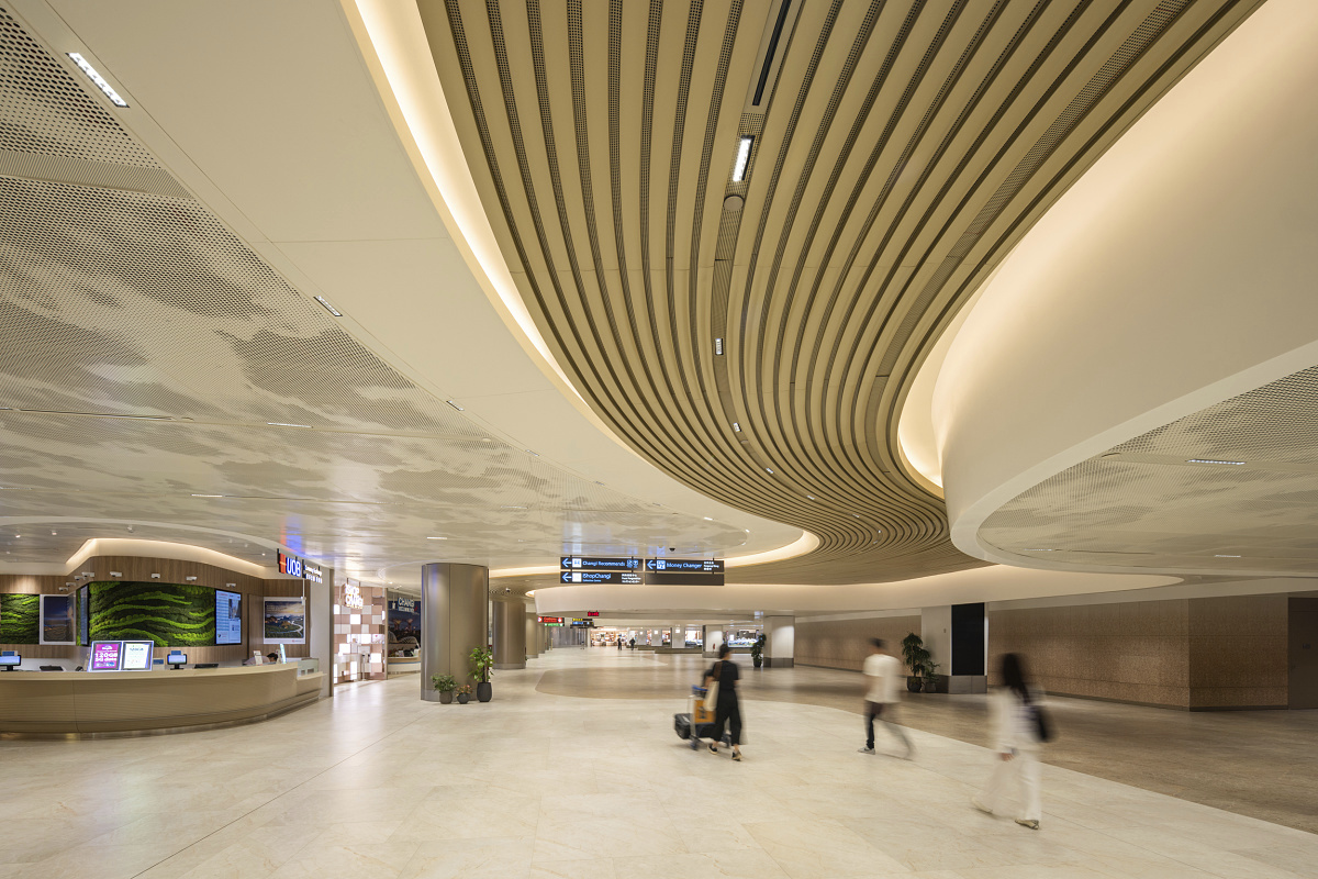 ERCO Compar downlights illuminate Changi Airport's Terminal 2 in Singapore, providing efficient and durable lighting.