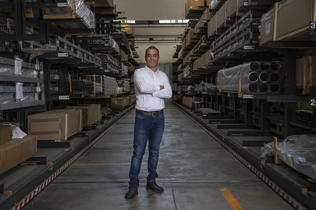 ERCO employee in warehouse, representing supply chain principles for sustainable collaboration.