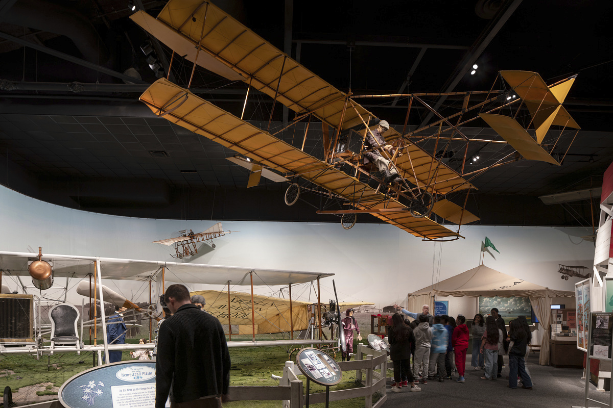 Vintage airplane exhibit at Cradle of Aviation Museum, New York, lit by ERCO LED spotlights.