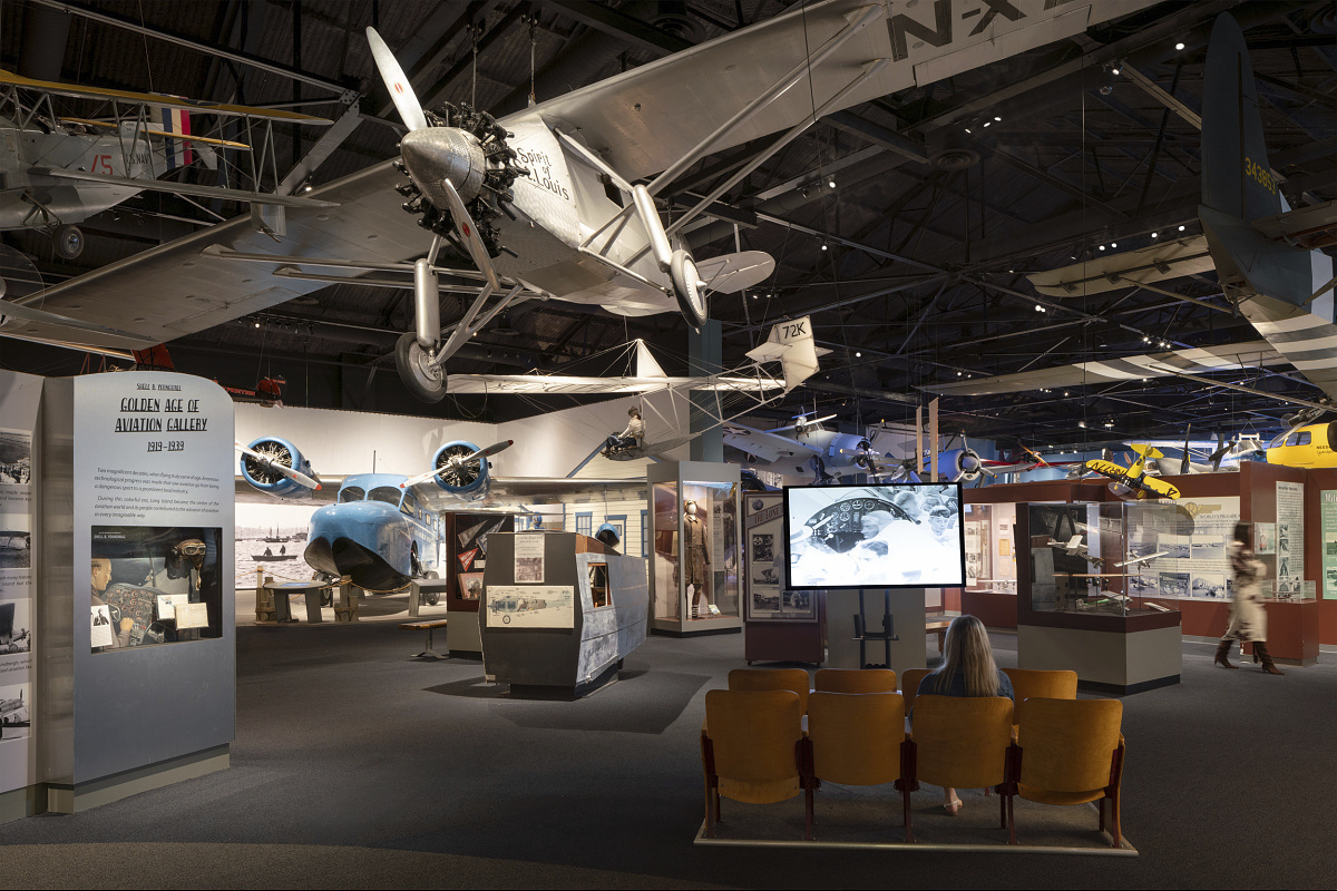 Interior of the Cradle of Aviation Museum featuring aircraft exhibits and ERCO LED lighting.