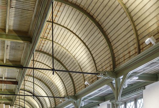 Historic De Krakeling ceiling with ERCO Optec spotlights for flexible office lighting.