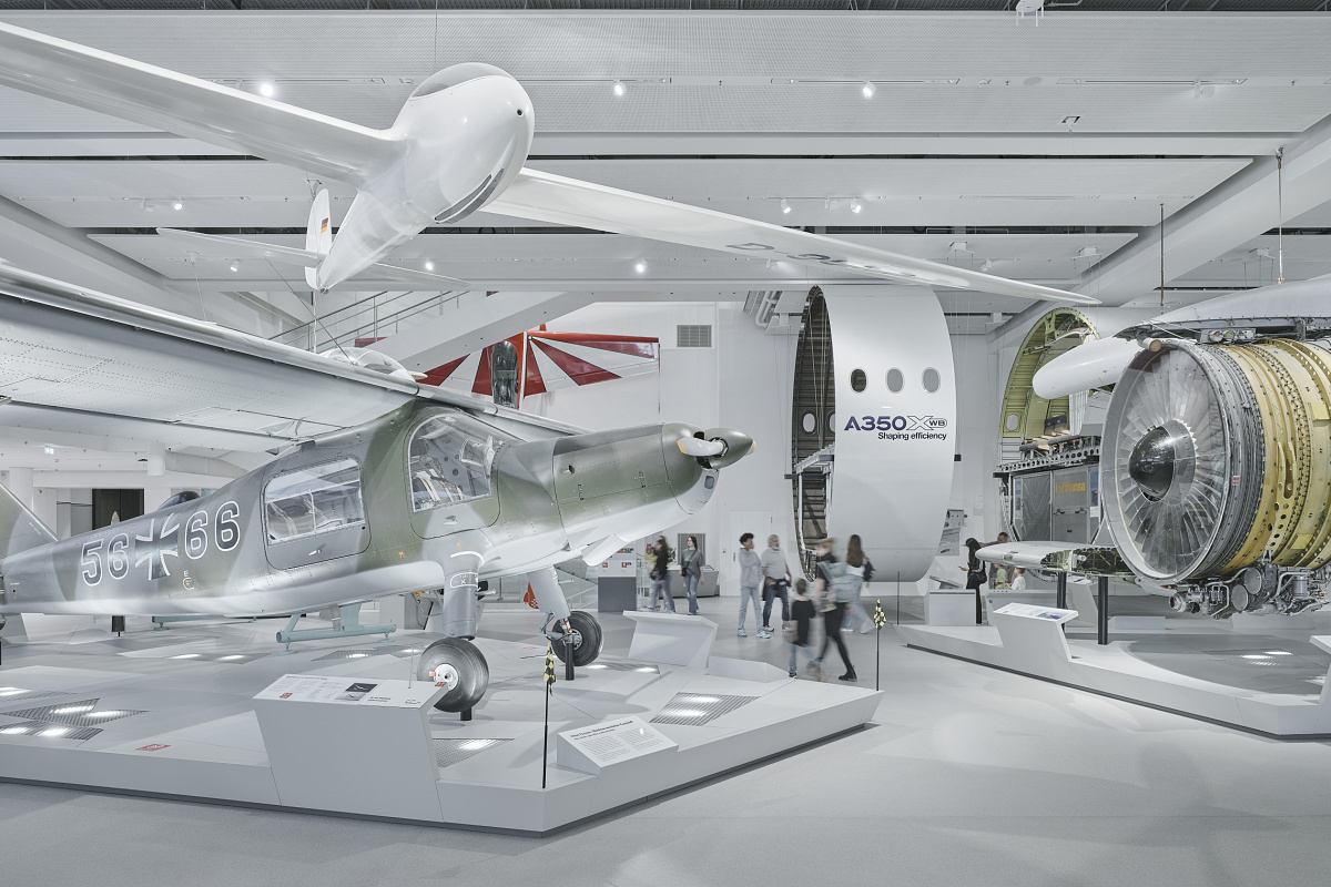 Aircraft exhibits at Deutsches Museum, Munich, illuminated by ERCO LED spotlights for a versatile exhibition.