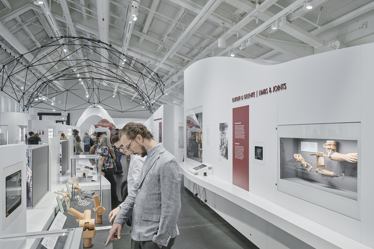 Visitors view ERCO LED-lit exhibits at Deutsches Museum, Munich.