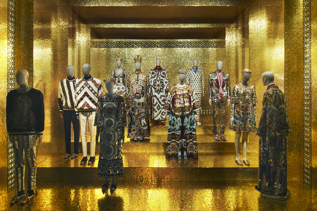 Dolce & Gabbana exhibition in Milan, illuminated by ERCO LED spotlights, highlighting fashion art.