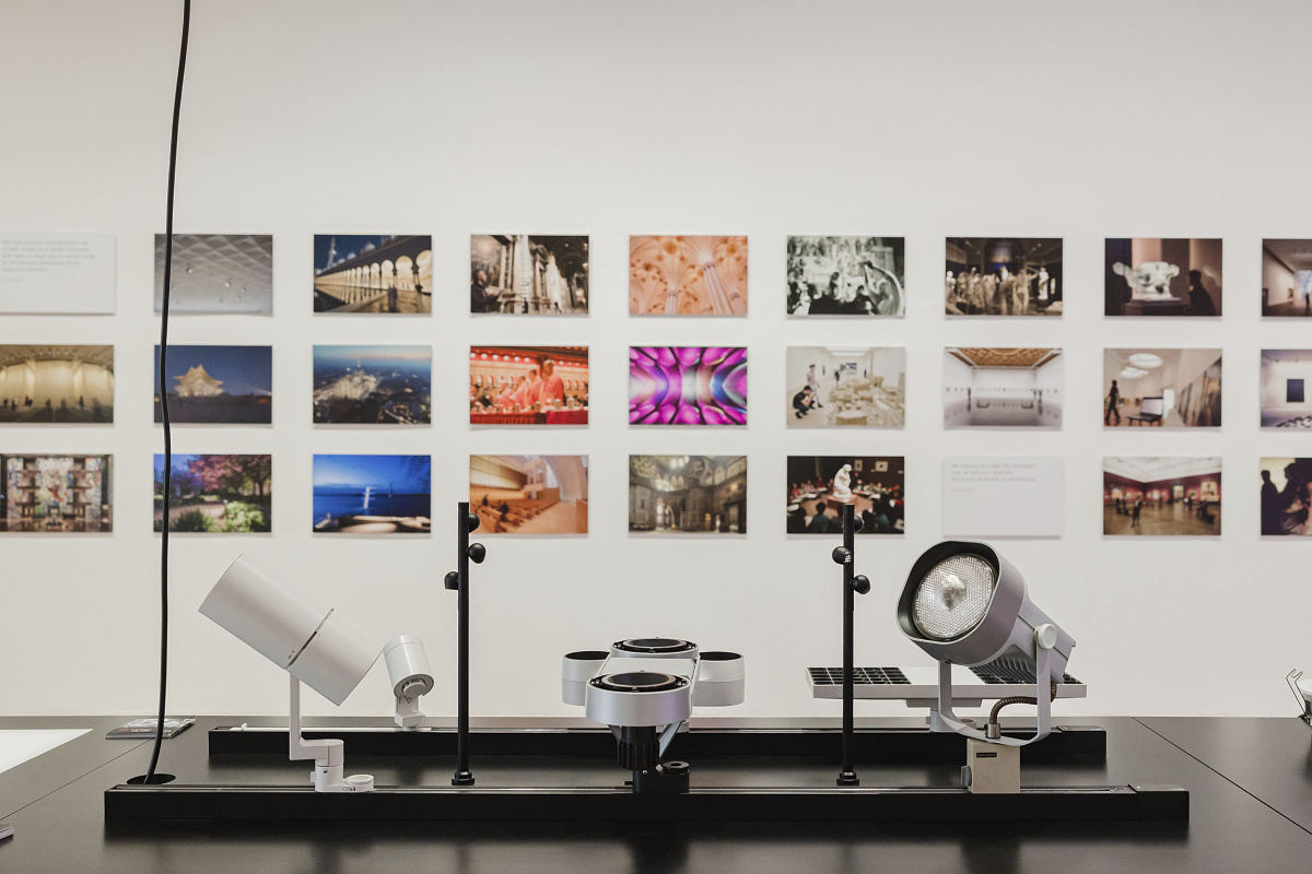 ERCO LED lighting showcased at the Light Box exhibition in Milan, blending light and photography.
