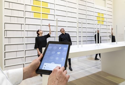 ERCO lighting design with tablet: Lighting experts at work, controlling the illumination.