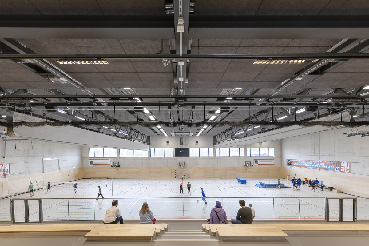 Neustadt gymnasium illuminated with ERCO LED lighting for sports and spectators.