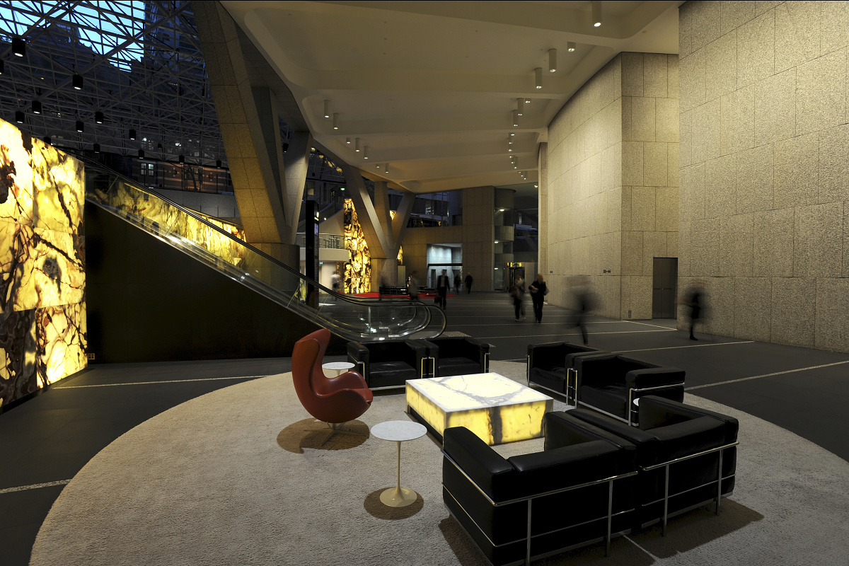 MLC Centre lobby in Sydney featuring ERCO wallwashing and LED downlights for high ceilings.