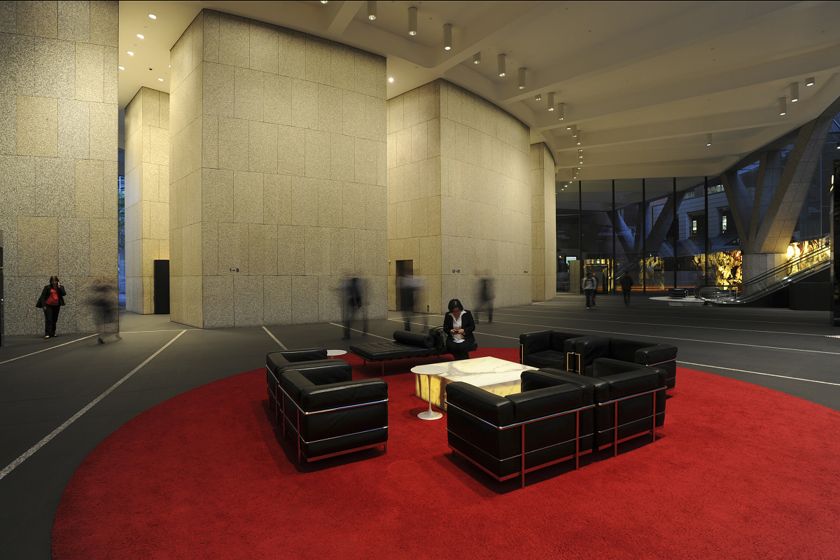 Shell House lobby featuring ERCO downlights and wallwashers highlighting art.