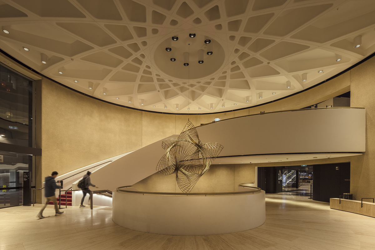 Shell House lobby in Melbourne featuring ERCO downlights and wallwashers highlighting art.