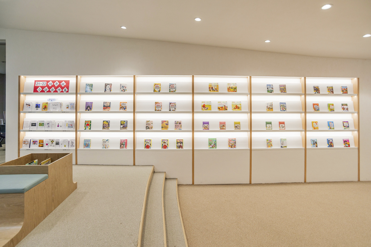 ISF Academy library featuring ERCO downlights for visual comfort and energy efficiency.