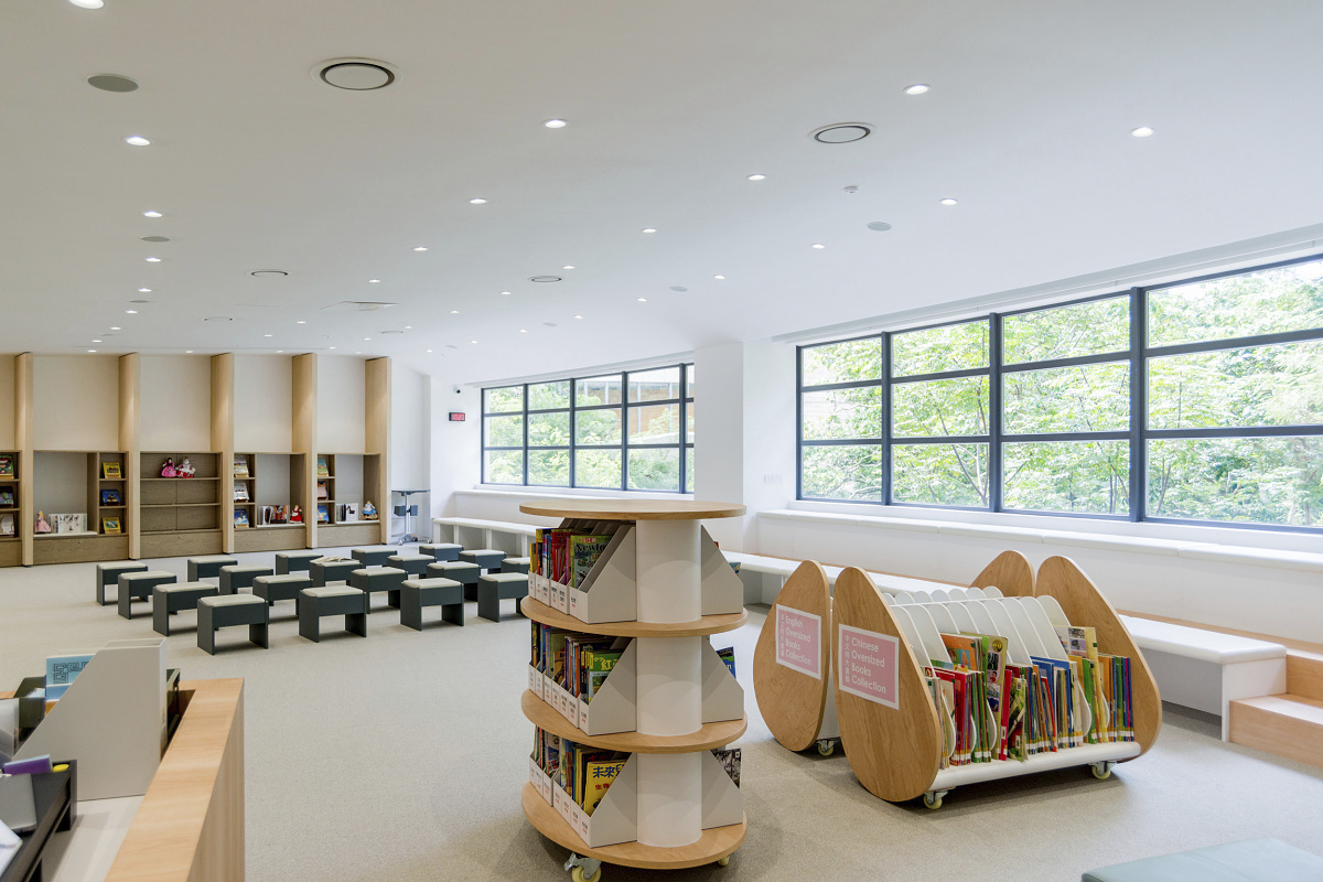 ISF Academy library featuring ERCO downlights for visual comfort and energy efficiency.