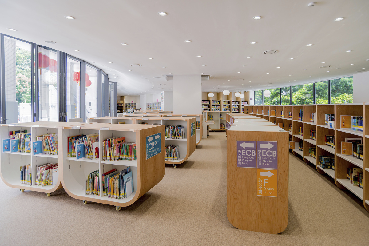 ISF Academy library featuring ERCO downlights for visual comfort and energy efficiency.