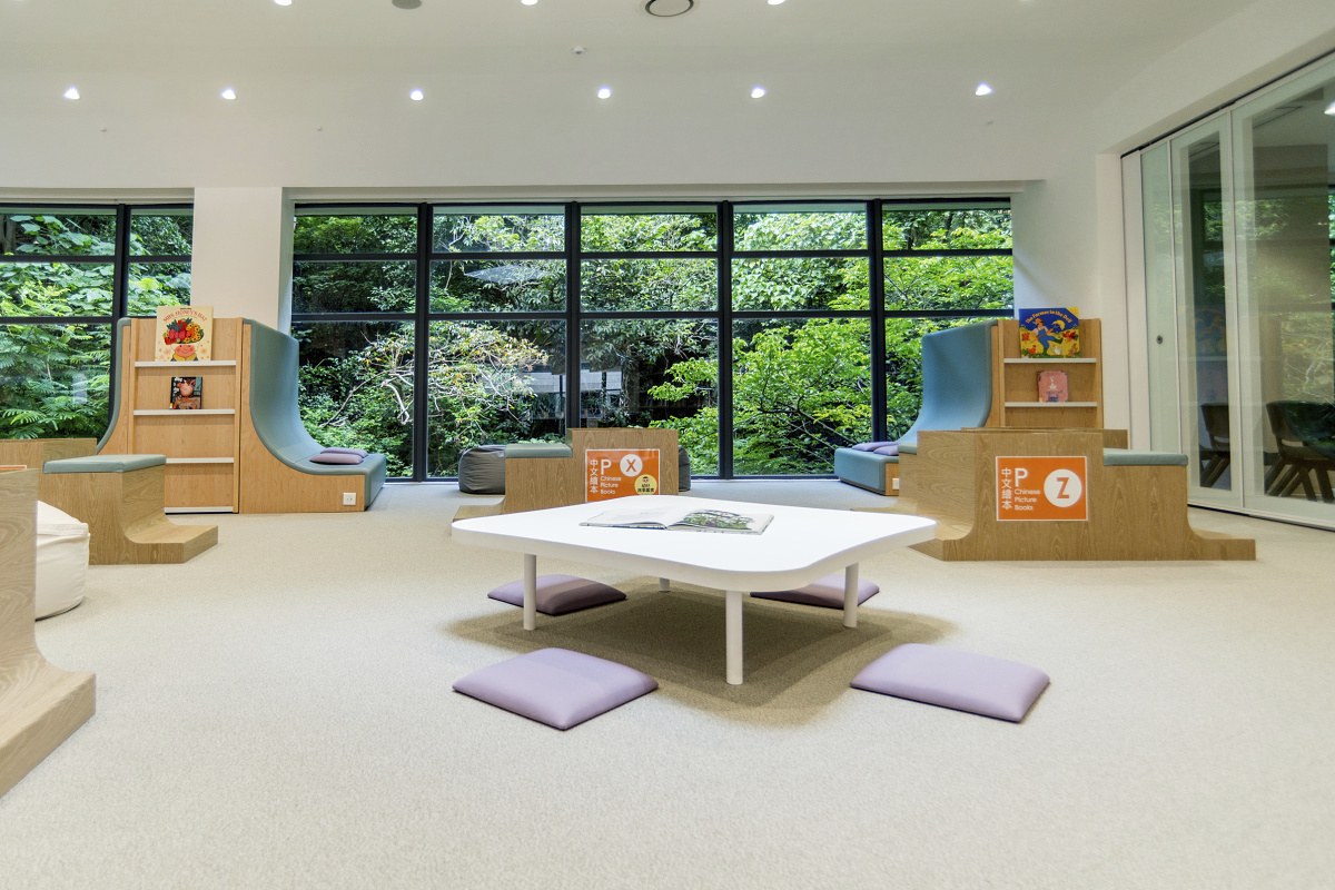 ISF Academy library featuring ERCO downlights for visual comfort and energy efficiency.