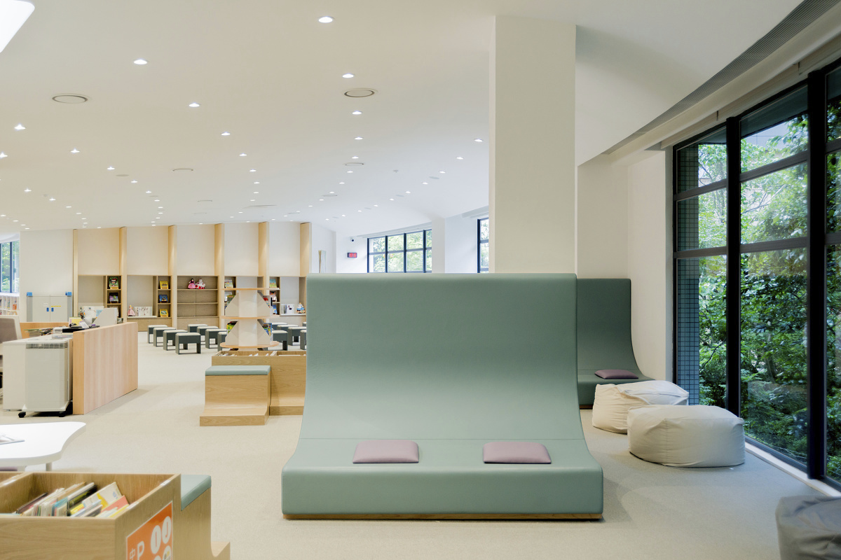 ISF Academy library, Hong Kong, featuring ERCO Skim downlights for visual comfort and energy efficiency.