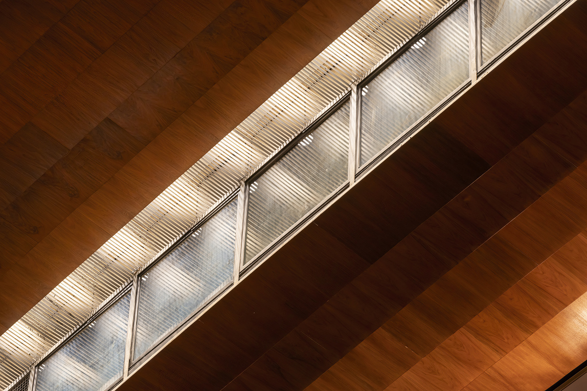 Hamburg State Opera window detail with wood paneling, illuminated by ERCO LED lighting.