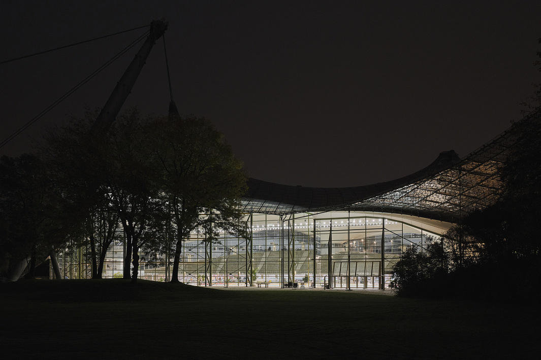 Aquatic Centre at Olympic Park, Munich, illuminated at night with ERCO LED lighting.