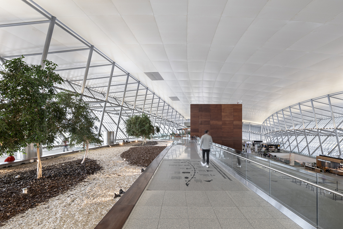 Carrasco International Airport's interior featuring sustainable ERCO LED lighting.