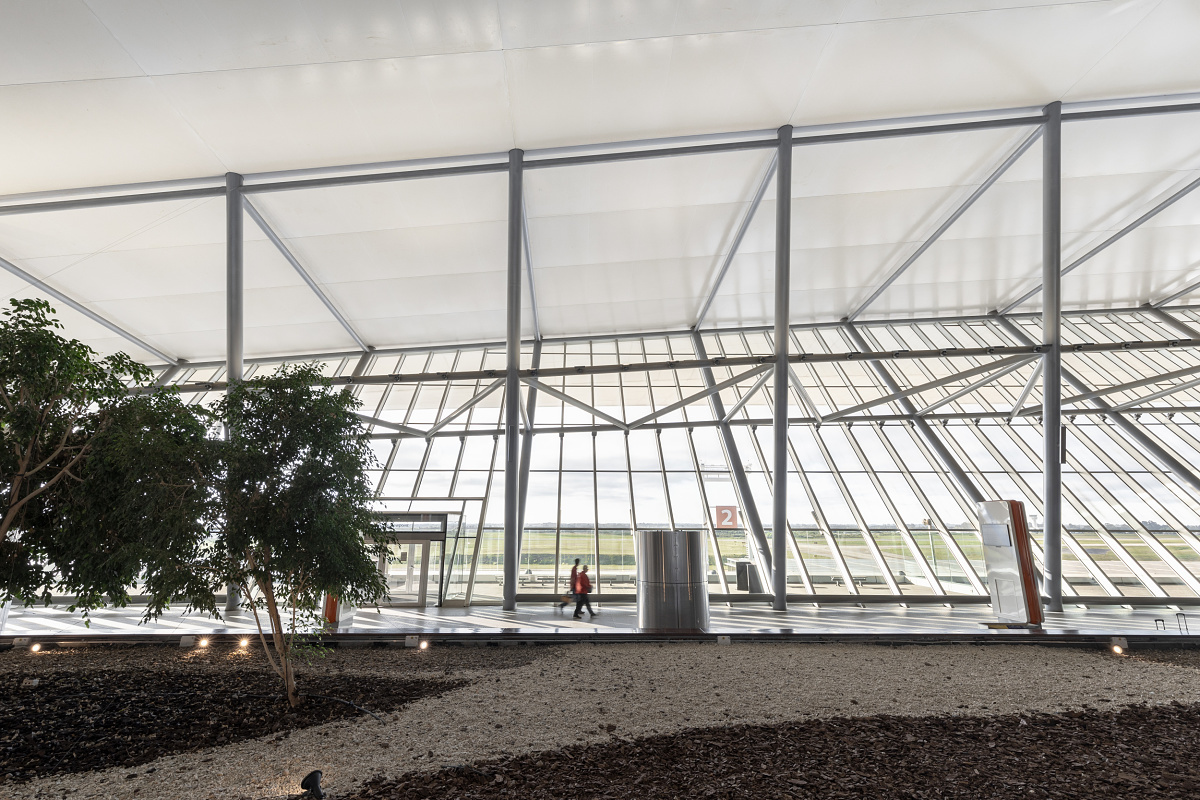 Carrasco International Airport's interior featuring sustainable ERCO LED lighting.