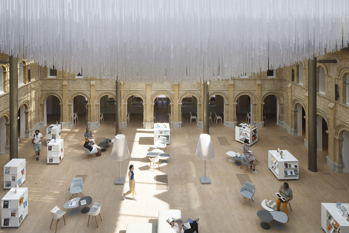 Les Franciscaines cultural venue featuring ERCO lighting in the reading area.