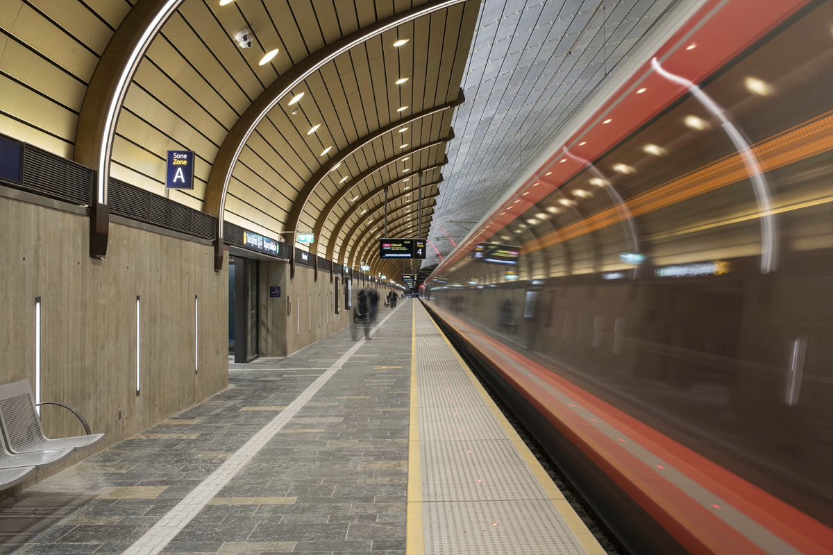 Train station illuminated with robust ERCO outdoor luminaires for safety and orientation.