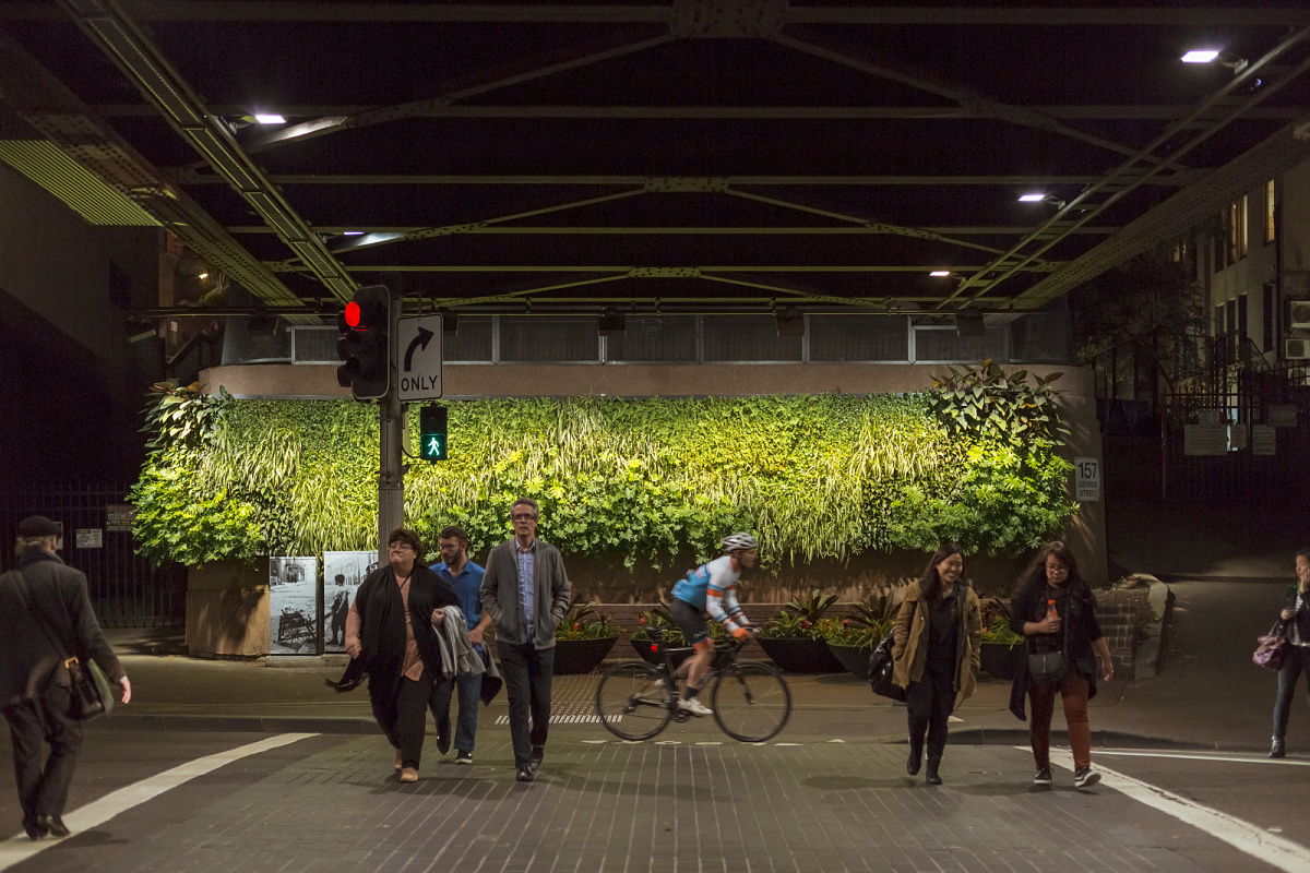Illuminated pedestrian crossing with ERCO outdoor luminaires for safe station pathways.