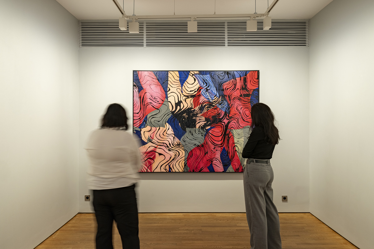 Visitors view art illuminated by ERCO LED lighting at Lilia Ben Salah Gallery in Paris.