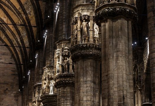 Detailed view of columns in Milan Cathedral illuminated by ERCO LED lighting.