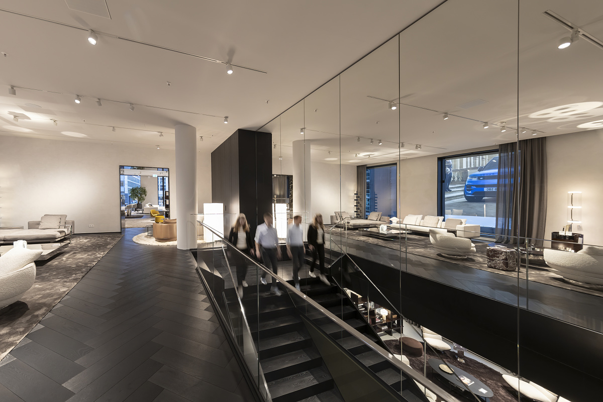 Minotti Flagship Store interior featuring ERCO Parscan spotlights highlighting furniture with dramatic light.