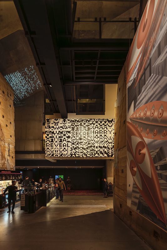 Interior of MONA Museum in Tasmania, featuring art installations and ERCO lighting.
