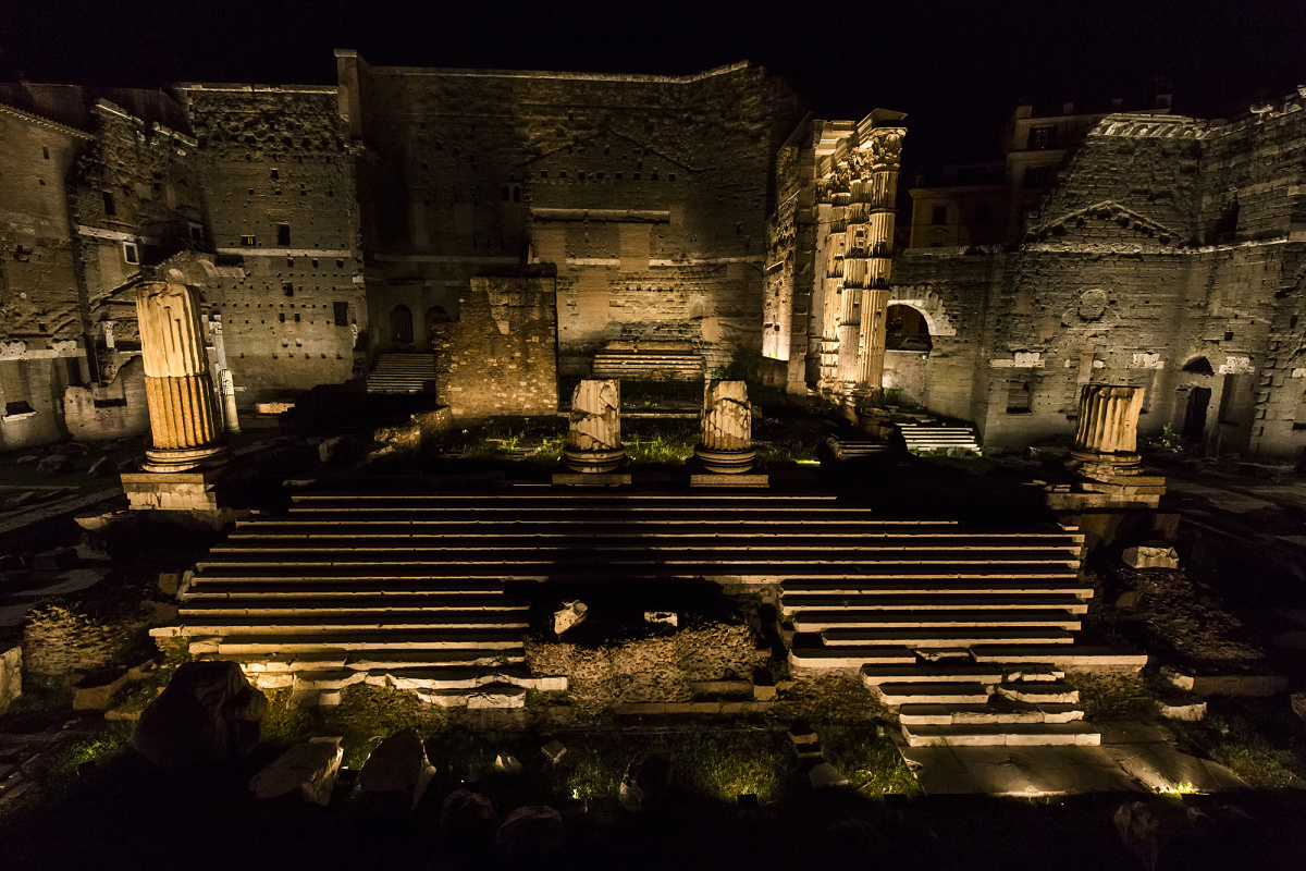 Illuminated Roman Forum ruins at night, featuring ERCO outdoor lighting.