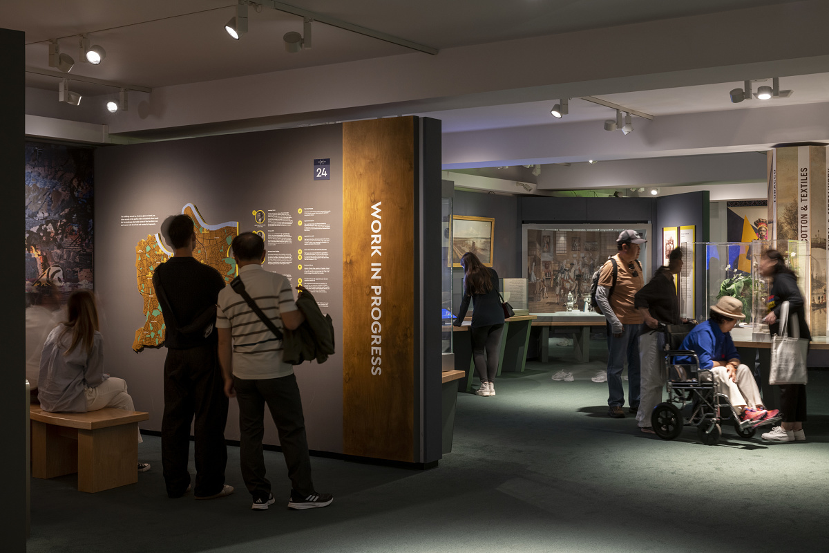 Visitors in the National Maritime Museum, London, illuminated by ERCO LED lighting.