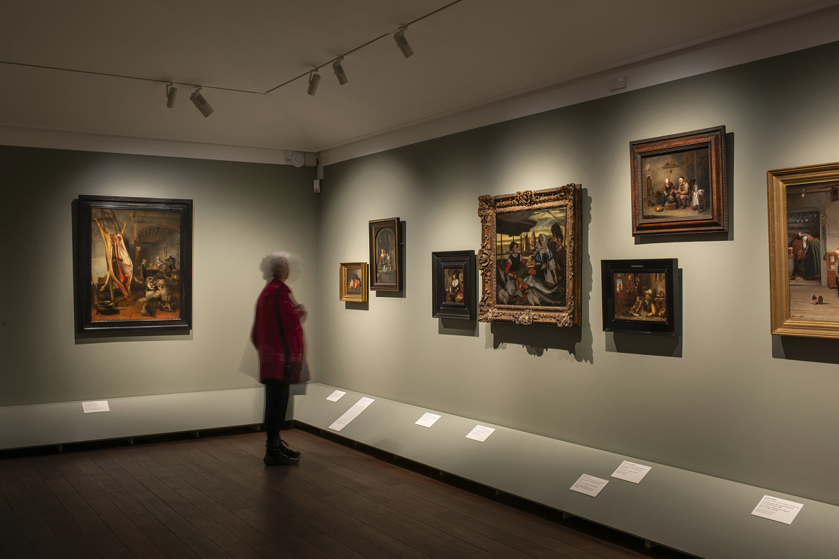 Visitor at Nivaagaard Museum viewing paintings illuminated by ERCO 48V LED spotlights.