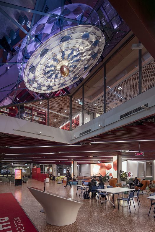 Interior of PHIVE in Parramatta Square, featuring decorative lighting and study areas.