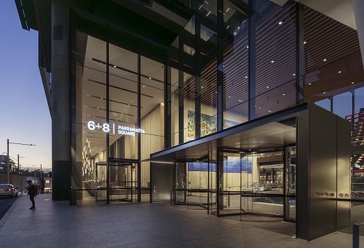 Entrance to 6+8 Parramatta Square, Sydney, featuring ERCO lighting for a welcoming ambiance.