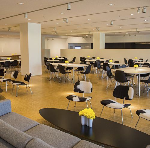 ERCO office space with tables and chairs for employees working on projects.